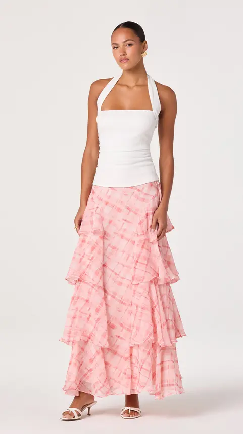 White halter top paired with a tiered pink floral maxi skirt