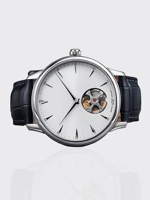 Watch with white face, exposed movement, black strap