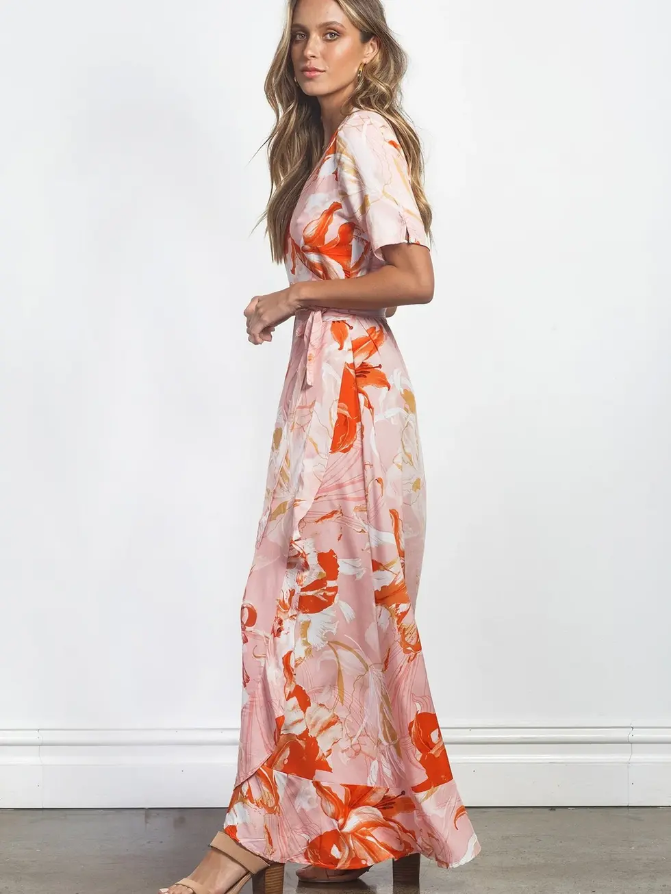 Woman wearing floral print dress looking at the camera, Charme dress.