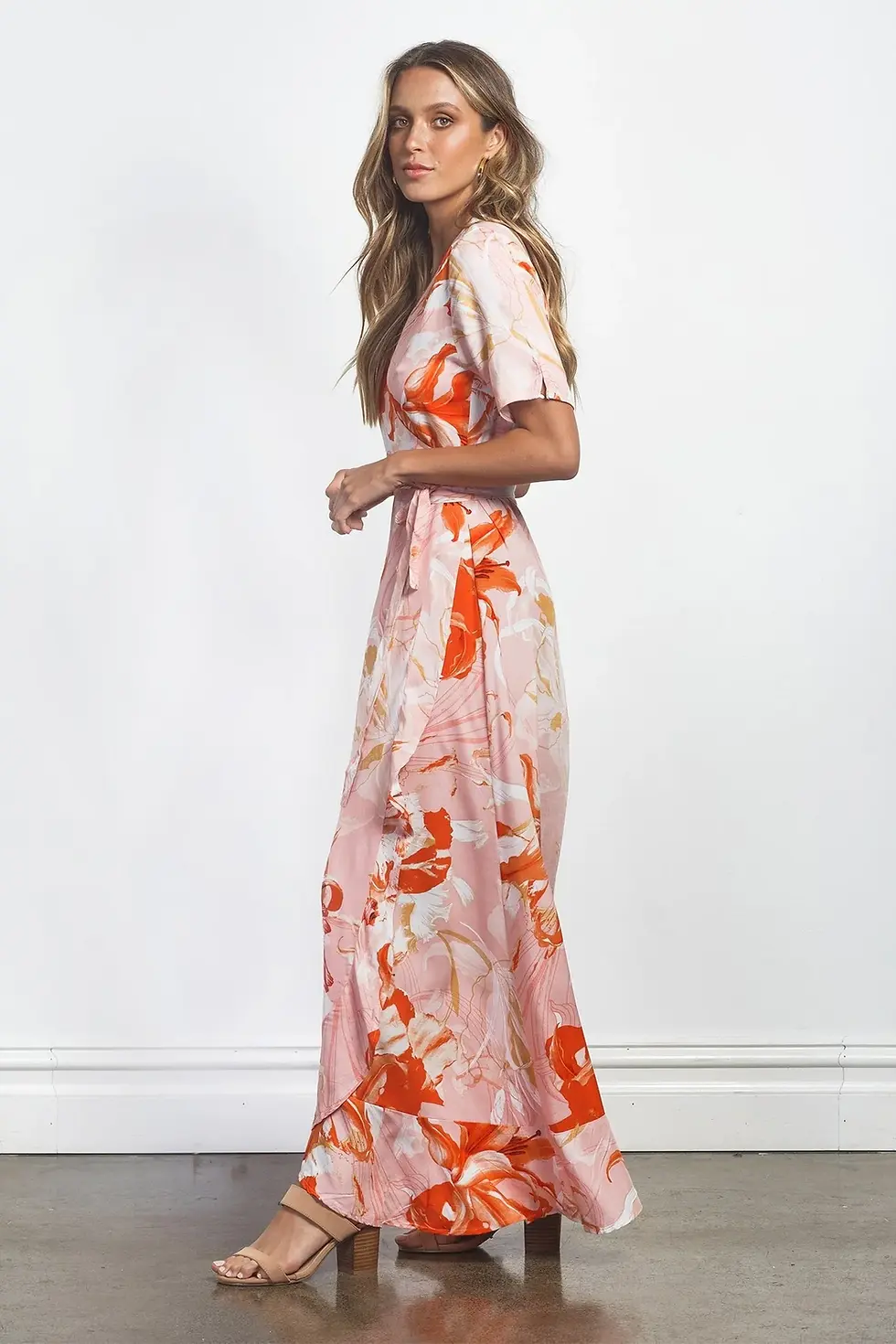 Woman wearing floral print dress looking at the camera, Charme dress.