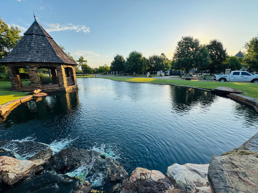 Commercial pond with water feature maintained by TurnPro Aquatics