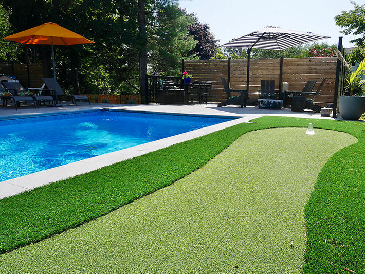 Pool with green turf and putting green