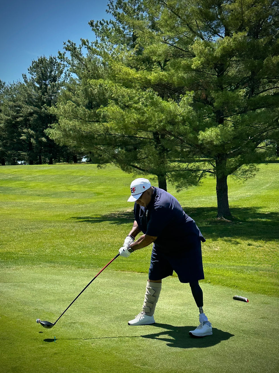 Links to Freedom adaptive golfer with a prosthetic leg hits a driver from the tee box.