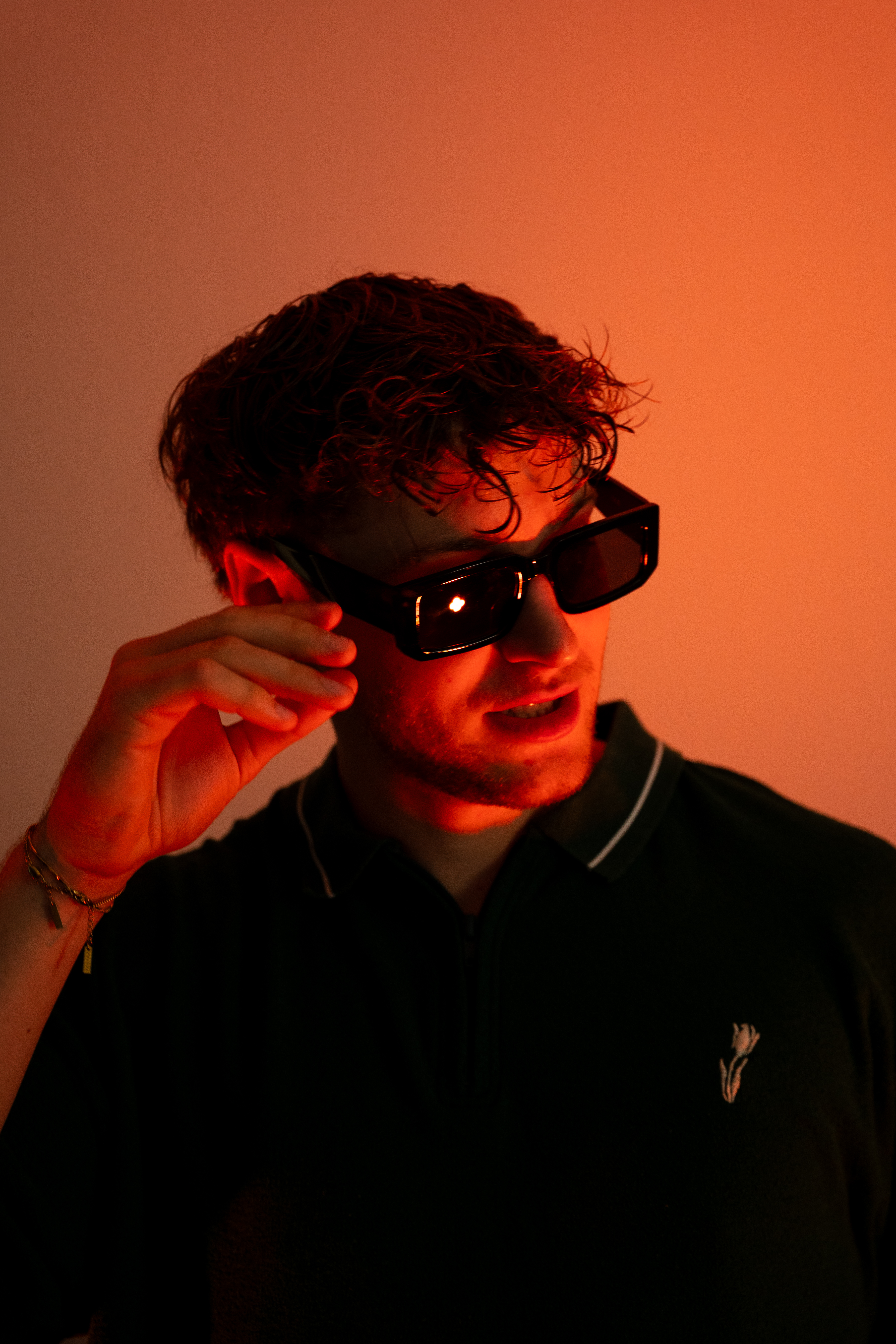 Portrait of LSTEN in warm orange light