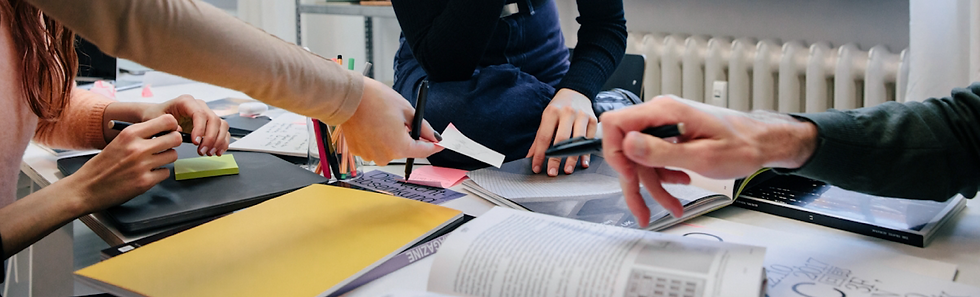 Team of people working on a branding concept around a table