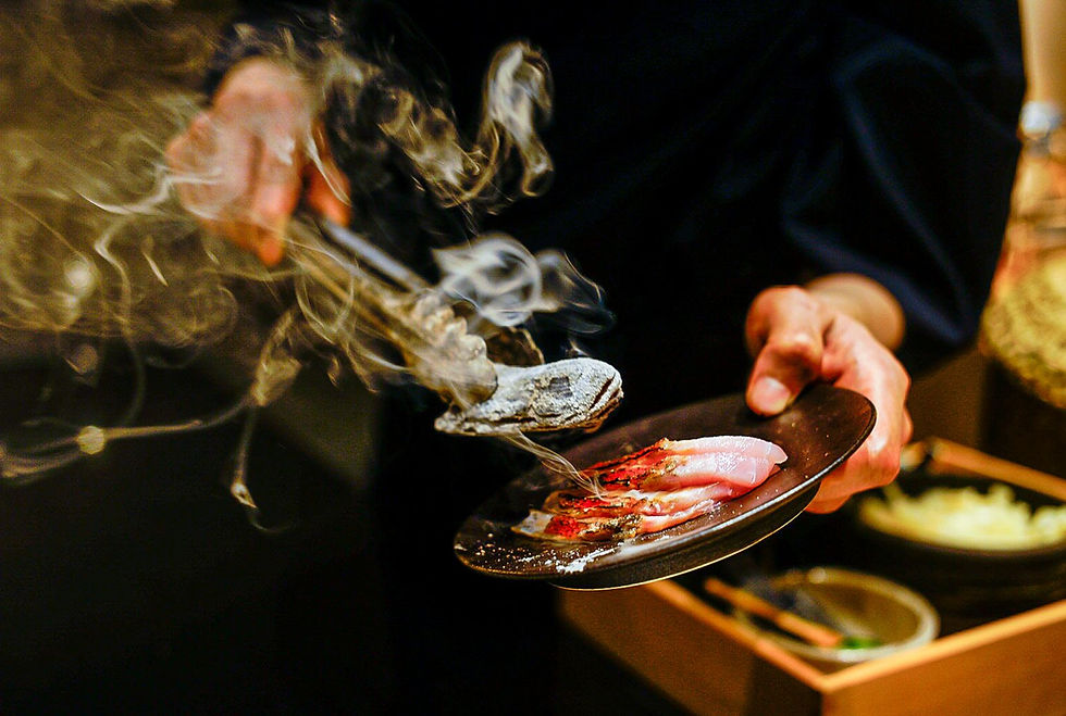 Close-up view of sushi chef preparing nigiri sushi at a sushi bar in Singapore