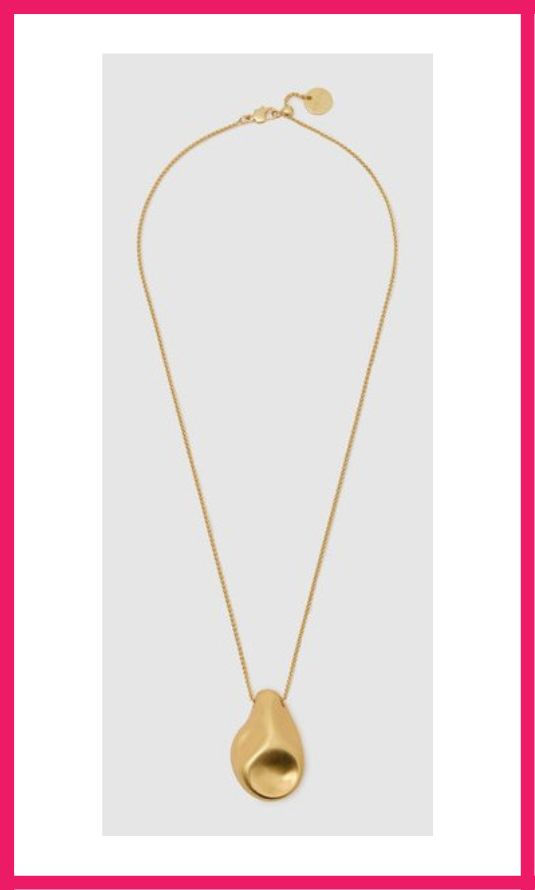 A minimalist gold pendant necklace, ideal for building a capsule wardrobe with