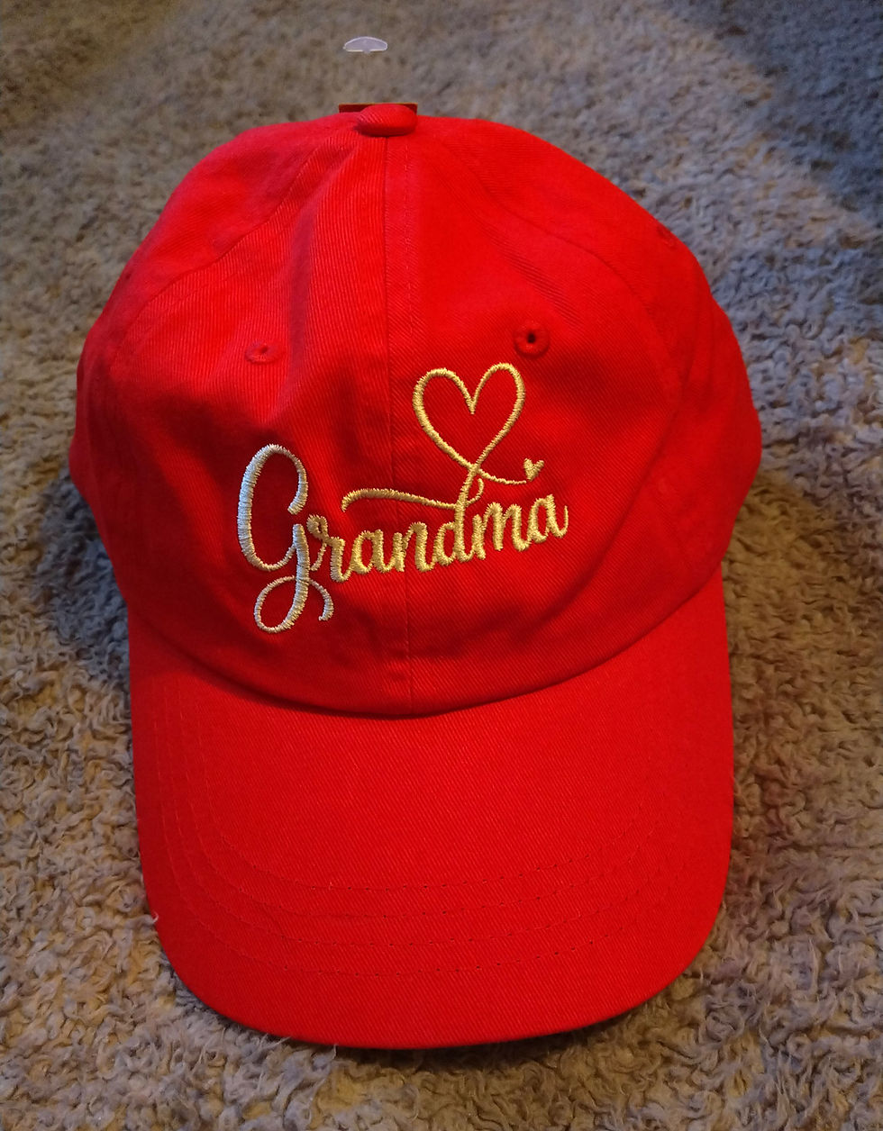 A red baseball cap with Grandma written on it
