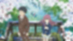 Anime scene: A boy and a girl look up into the camera, surrounded by cherry blossoms. Taken from the film A Silent Voice (2016).