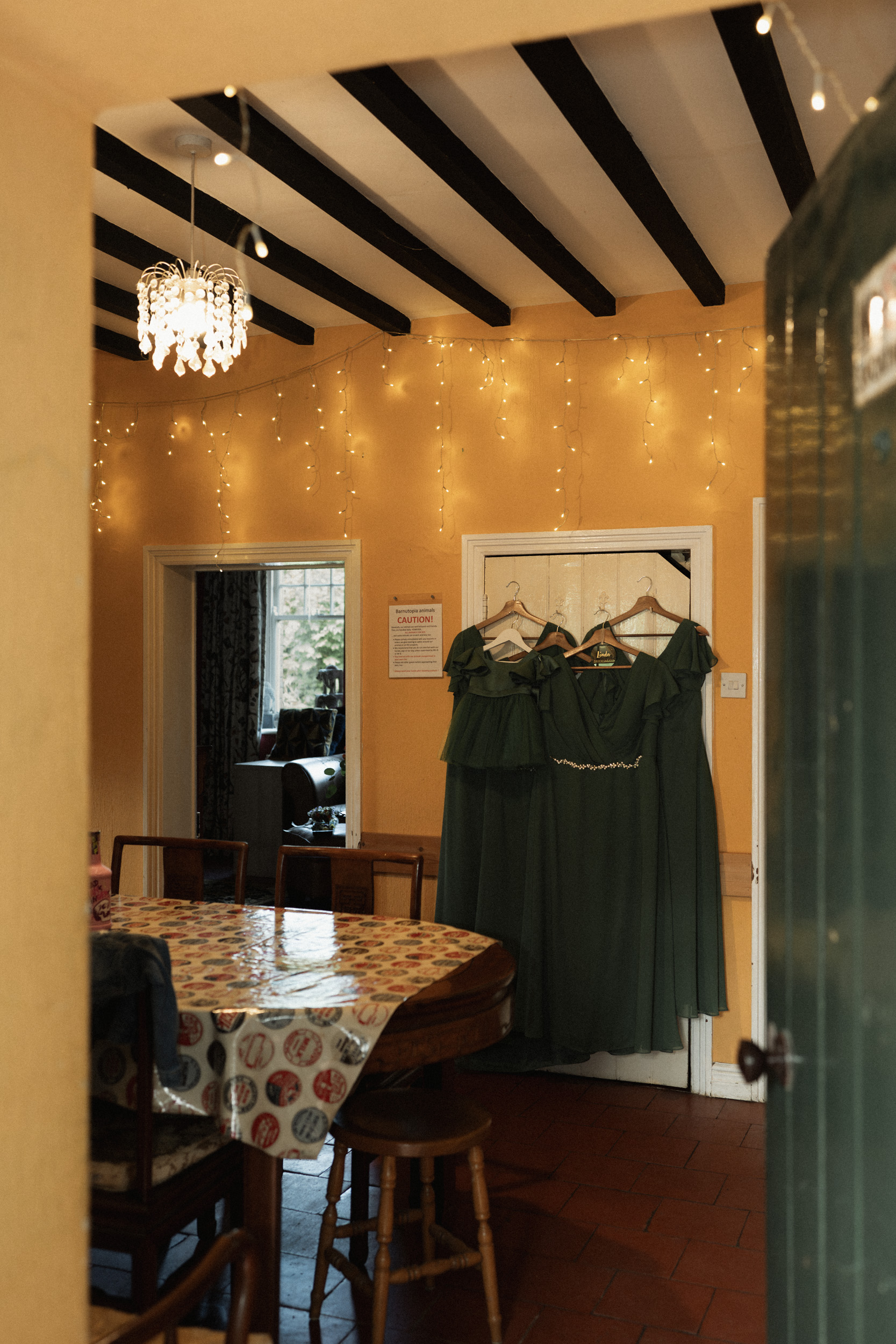 Documentary wedding photograph of bridesmaid dresses hanging before the ceremony