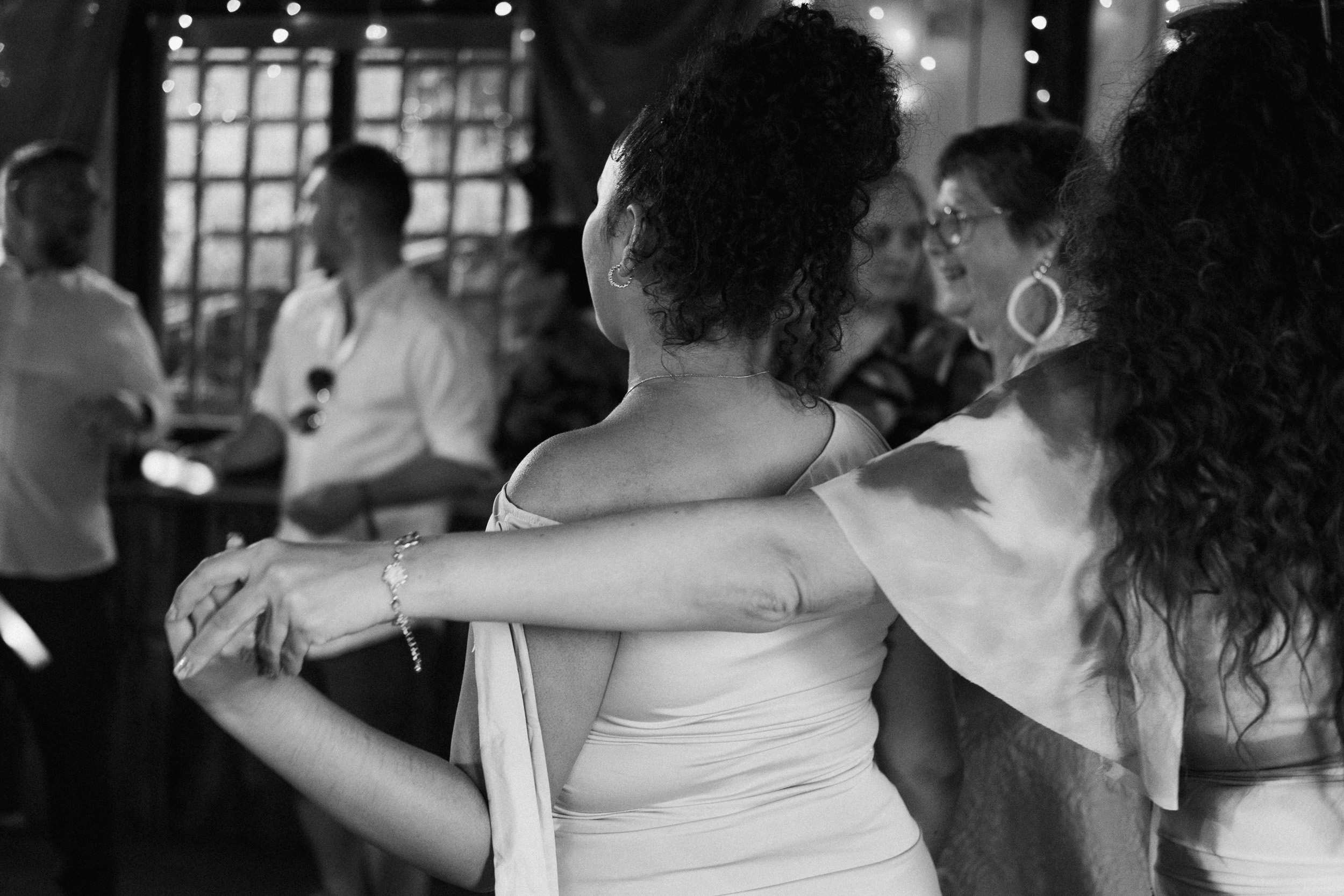 Unscripted moment of the wedding guests holding hands