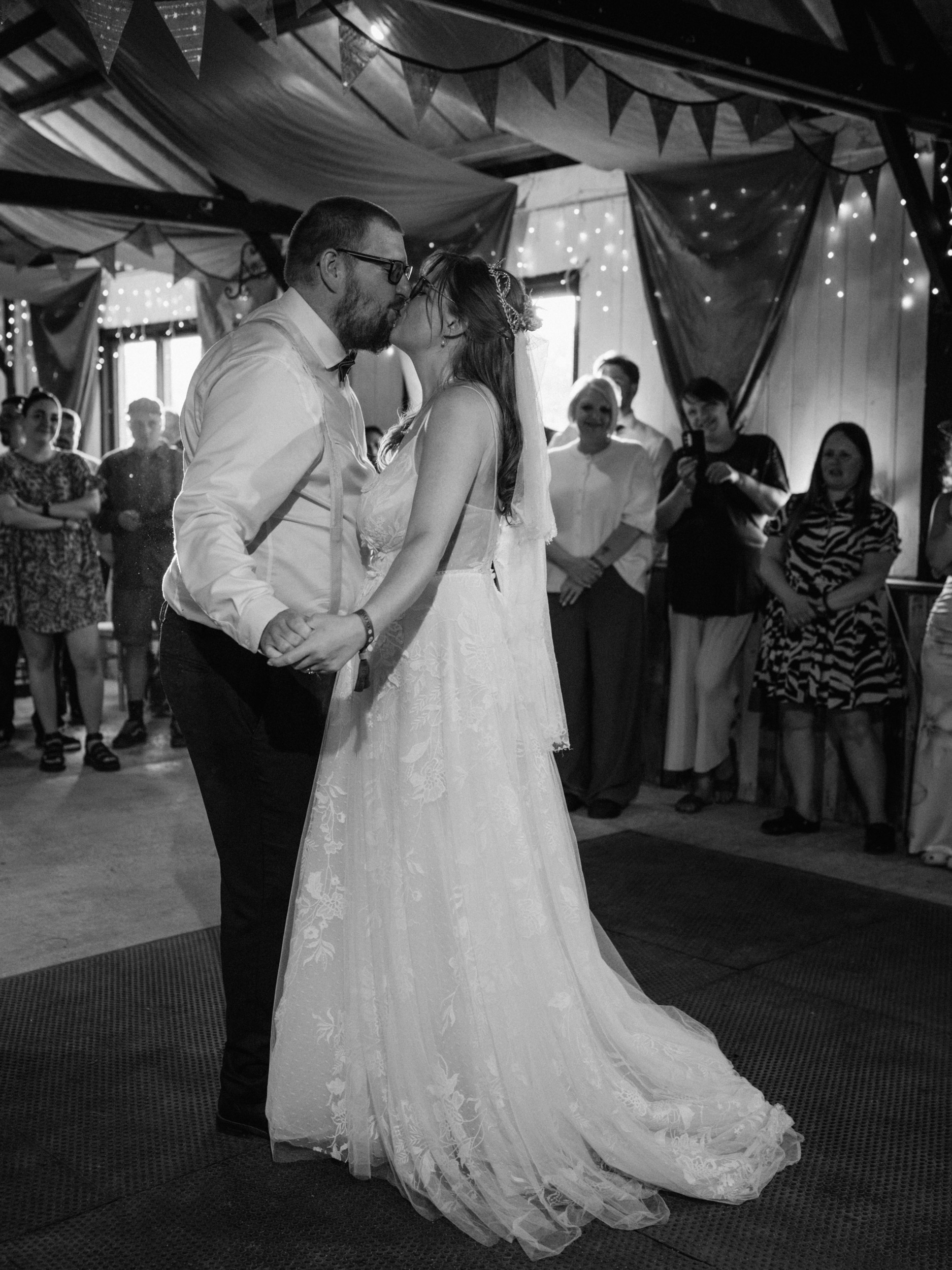 Wedding couple first kiss during their first dance