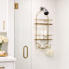 Gold metal shower caddy for bathroom storage mounted inside shower