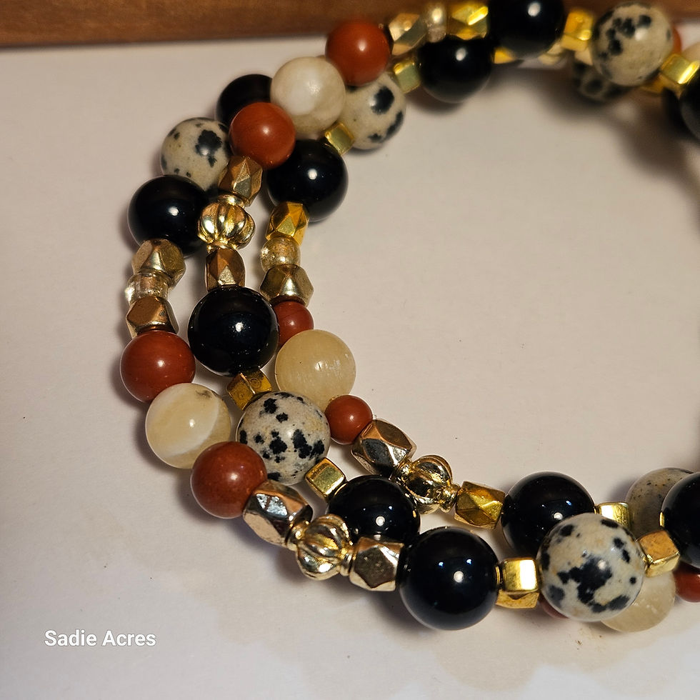Beaded bracelet with black, speckled, red, and gold