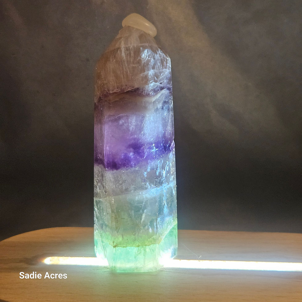 Hand-selected crystal tower on a lighted base.