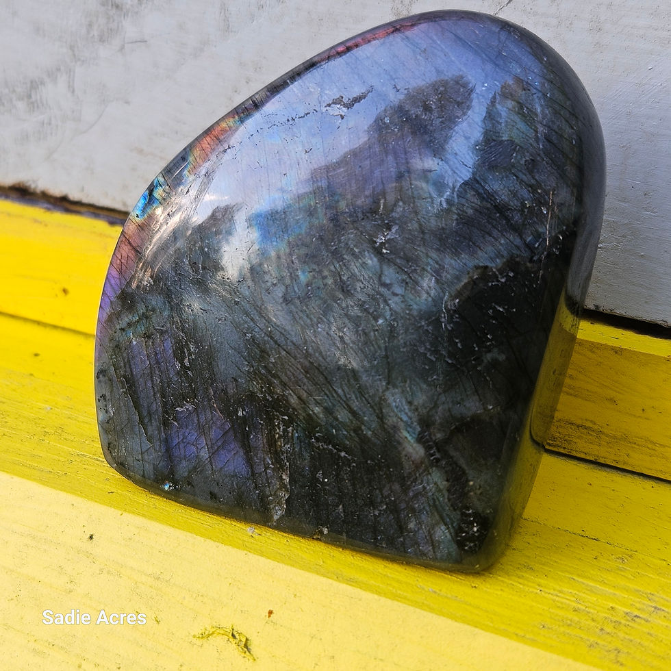 Thumbnail: Iridescent purple and blue polished stone