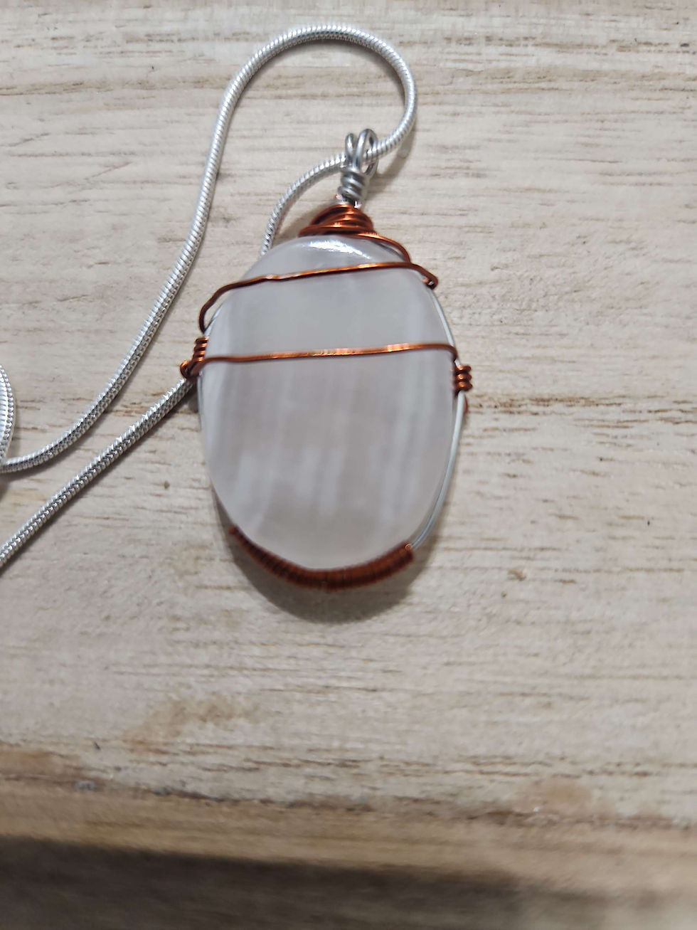 Thumbnail: Copper wire wrapped pink calcite pendant