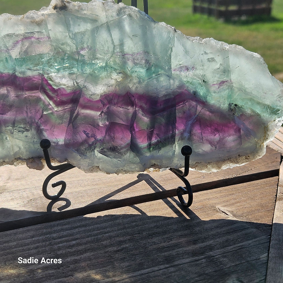 Thumbnail: Banded purple and green mineral on a stand