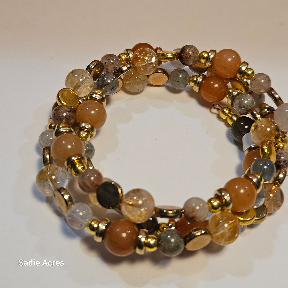 Multi-strand bracelet with gold, brown, and clear beads
