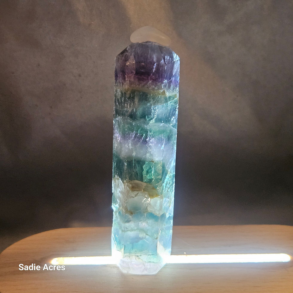 Hand-selected crystal gemstone tower with purple and green hues