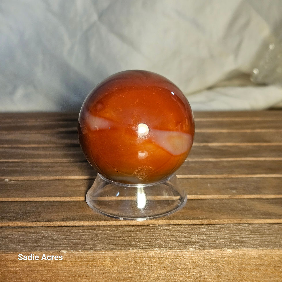 Thumbnail: Artisan hand-selected crystal sphere on a wooden stand.