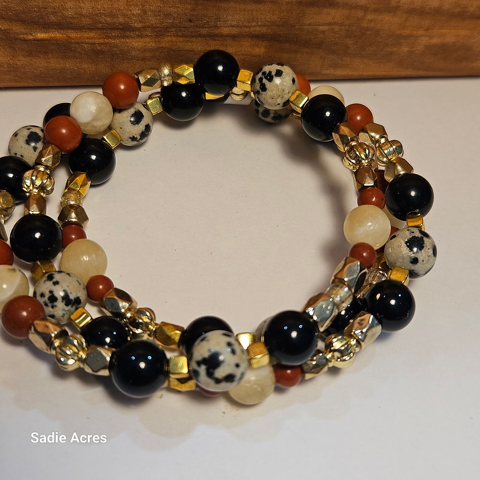 Multi-strand bracelet with black, dalmatian, and red beads