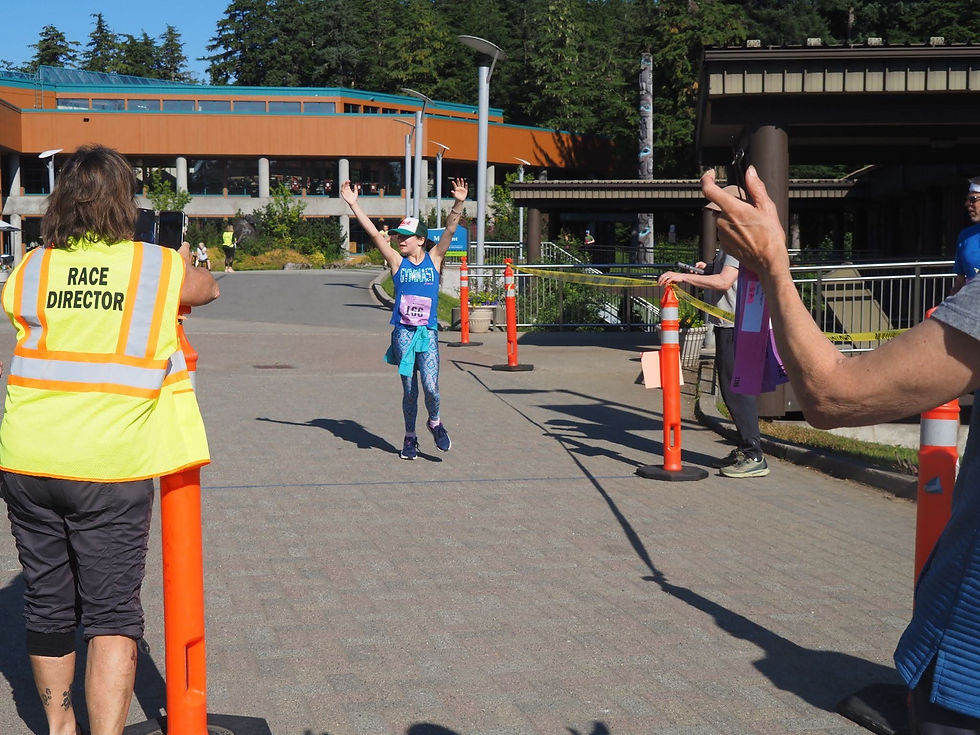 Mackayla Orr crosses the finish line of the Beat the Odds 5K run at the University of Alaska Southeast campus on Saturday, Aug. 15, 2026. (Natalie Buttner / Juneau Independent)