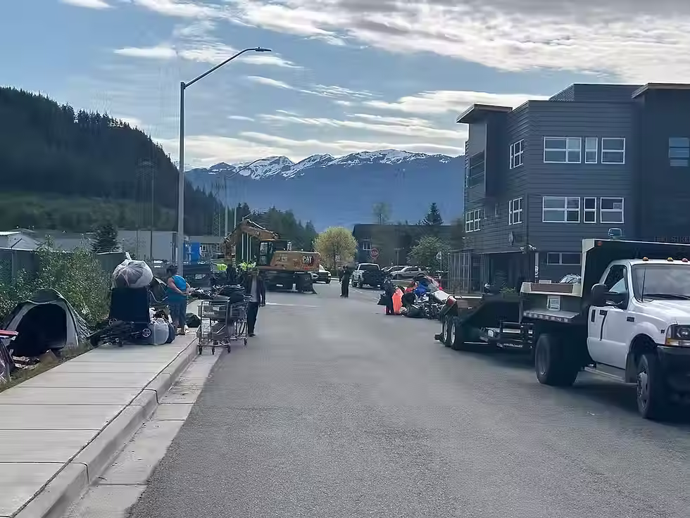 Occupants of about 20 tents on Teal Street pack belongings as they are forced by city officials to leave on Tuesday, June 17, 2025. (Mark Sabbatini / Juneau Independent)