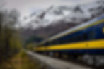 An Alaska Railroad train is in motion through the Chugach National Forest near Portage. (Photo by A&J Fotos/Getty Images)