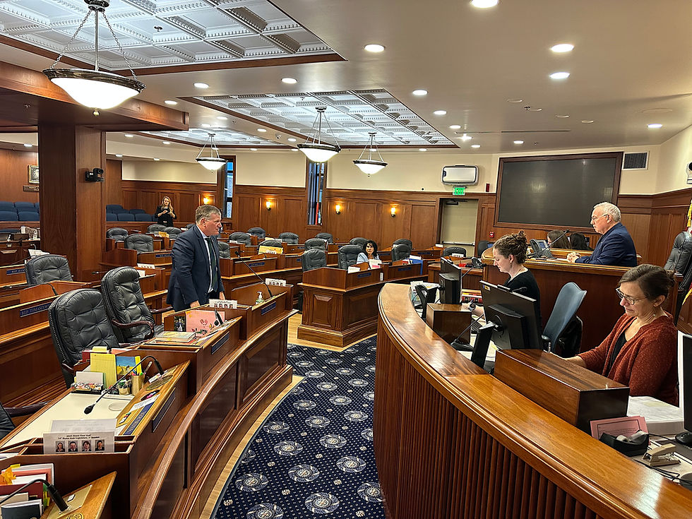 House Majority Leader Chuck Kopp, R-Anchorage, left, motions for the House to adjourn until Aug. 31 during a floor session that lasted less than 30 seconds on Tuesday, Aug. 19, 2025. House Speaker Bryce Edgmon, I-Dillingham, and House Minority Whip Cathy Tilton, R-Wasilla, were the only other House members in the chamber during the technical session. (Mark Sabbatini / Juneau Independent)