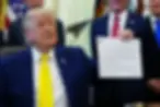 President Donald Trump holds up an image taken from his Truth Social account at an event about coal, Thursday, June 4, 2026, in the Oval Office of the White House in Washington. (AP Photo/Julia Demaree Nikhinson)