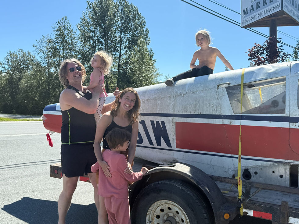 Rune Monstad (left) holds daughter Signy Monstad, while Amelia Monstaad holds son Hugo and Thor climbs on a Piper PA 28-140 plane the family bought in Haines, Alaska. The Haines Junction family intends to suspend the plane in a Quonset hut on their property for use as a children’s playhouse. (Rashah McChesney/Chilkat Valley News)
