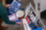 Washington Post reporter Tara Copp saves the name plaques from various news organizations as she and members of the media pack up their belongings in the press area in the Pentagon, Oct. 15, 2025, in Washington. (AP Photo/Kevin Wolf, File)