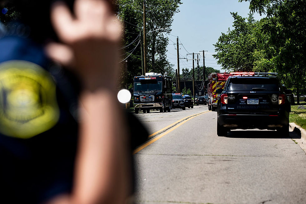 Multiple ambulances and police vehicles respond to a shooting at CrossPointe Community Church in Wayne, Mich., in June. Homicides fell 17% in the first half of 2025 compared with the same period in 2024, according to the Council on Criminal Justice’s latest crime trends report. (Emily Elconin/Getty Images)