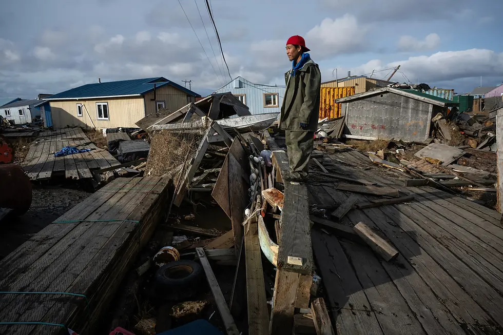 Zacharias John looks at the devastation left by Halong in Kipnuk on Oct. 17. John decided to stay back and help the few people who remain in the village. (Marc Lester / Anchorage Daily News)