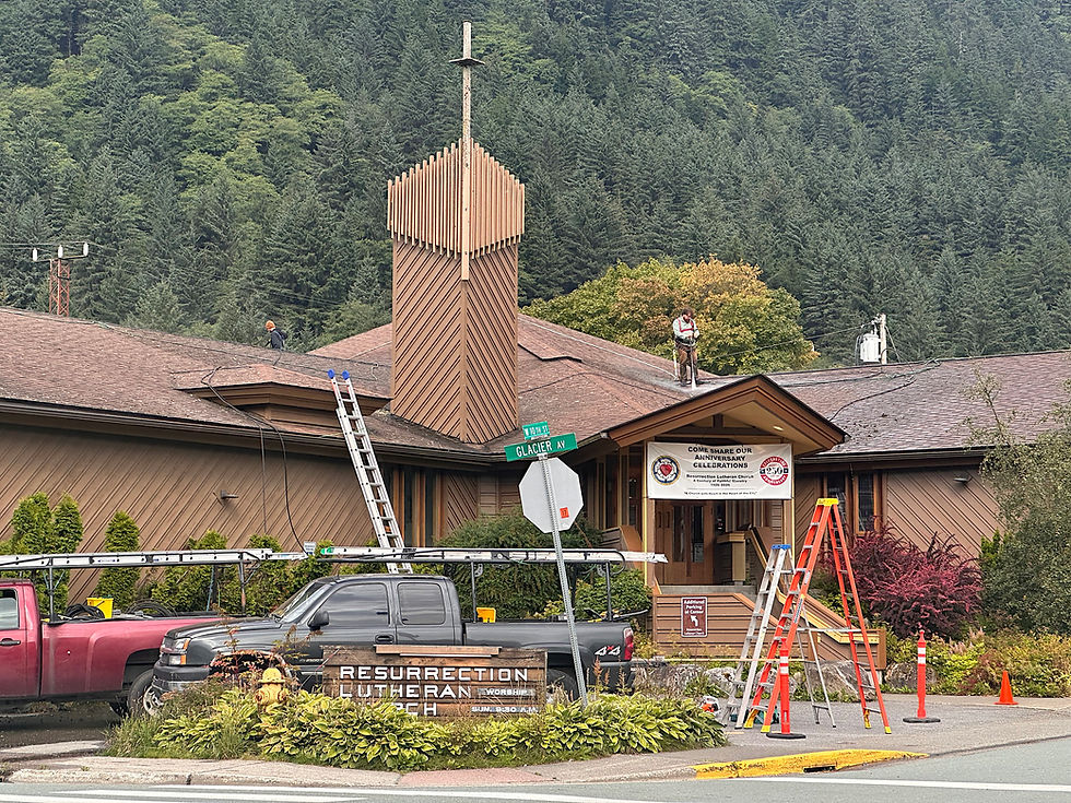Workers clean the roof of Resurrection Lutheran Church on Sept. 10, 2026. (Mark Sabbatini / Juneau Independent)