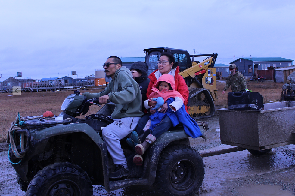 Community members in Kwigillingok ride to the village’s airport during a mass evacuation by military helicopter and small planes last month. (Nathaniel Herz/KYUK and Northern Journal)