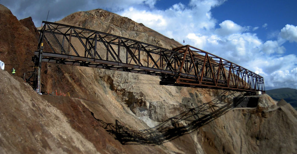 The bridge that will allow vehicles to pass over the Pretty Rocks landslide at Denali National Park is seen in early August 2025 as it was being slowly pulled into place. The onoing thaw-induced landslide, which accelerated and made the road impassable late in the summer of 2021, prompted the bridge project. The bridge project is expected to be completed in 2026. (Photo provided by the National Park Service)