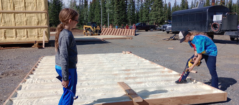 The Hunter family helps out with a home rebuild in Tok, which has been devastated by the Mukluk Fire. (Photo courtesy of Heather Smith)