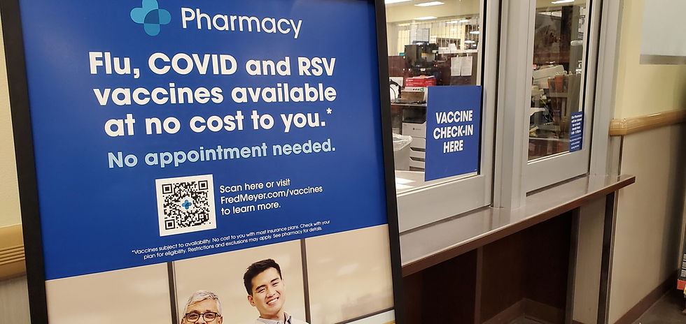 A sign at an Anchorage Fred Meyer store, seen on Tuesday, gives information about the availability of vaccines for influenza and other respiratory diseases. The annual flu season starts each fall. (Yereth Rosen/Alaska Beacon)