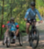 David Cesar and son Michael Cesar cycle a Juneau trail in July. David hopes to ride and Michael run in the Nov. 1, 2026, New York City Marathon. (Photo courtesy Michael Cesar)