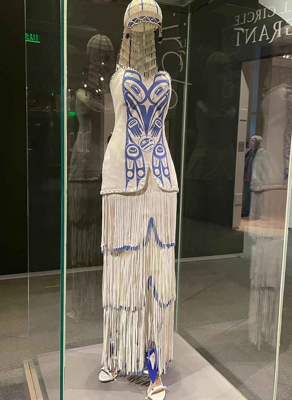Designer Dorothy Grant’s “Raven Takes the World” Haida Wedding Dress is on display with the museum’s summer exhibition until October 17, 2026. Friends of the State Libraries, Archives and Museum funded the transportation of the gown, on loan from the Smithsonian Institution’s National Museum of the American Indian. (Laurie Craig / Juneau Independent)