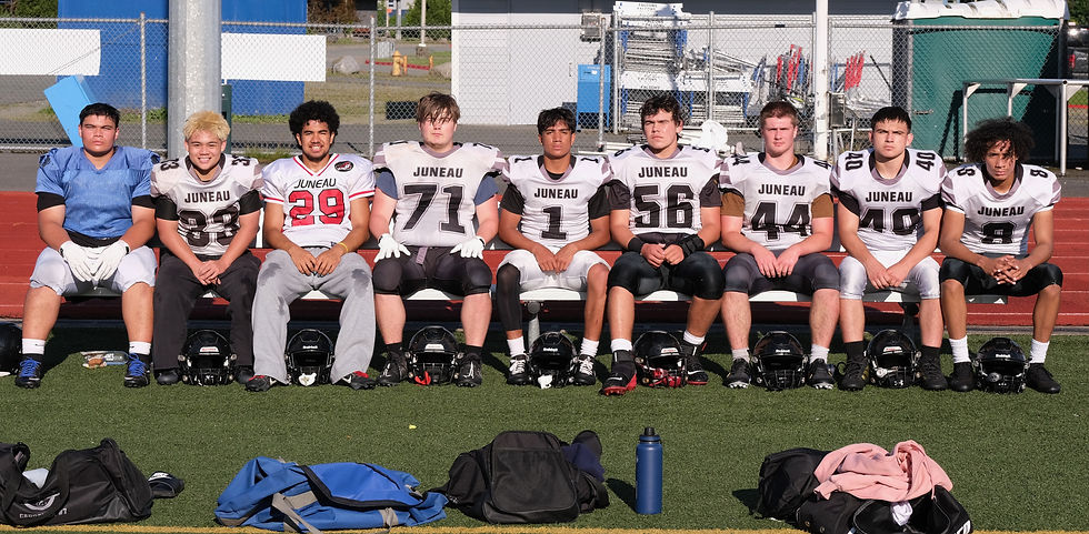 Juneau-Douglas High School: Yadaa.at Kalé senior football players Ricky Tupou, Gunnar Niere, Mati Iona, Kyle Carter, Noah Ault, Jonah Mahle, Hyrum Fish, Alex Marx-Beierly and Daniel Campbell pose for a photo at the Crimson Bears practice Tuesday at the Thunder Mountain Middle School field. The Crimson Bears open their season Aug. 15 in Anchorage against the Service Cougars. (Klas Stolpe / Juneau Independent)