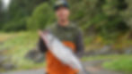 Bruce Williams holds his 11.2-pound king at the Amalga Harbor Weigh Station on Friday, August 8, 2025. (Ellie Ruel / Juneau Independent)