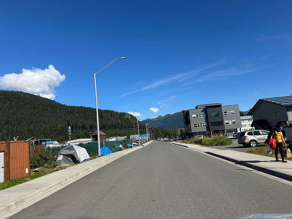 Tents occupied by people experiencing homelessness are placed across the street from the Glory Hall shelter and other social service agencies on Teal Street on Tuesday, Aug. 19, 2025. (Mark Sabbatini / Juneau Independent)