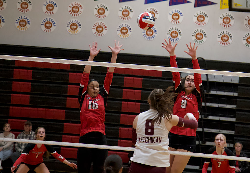 Juneau-Douglas High School: Yadaa.at Kalé’s Analie Perry (10) and Ruby Koski (9) try to defend a hit during pool play against Ketchikan High School at the 2026 Juneau Volleyball Extravaganza tournament on Saturday, Oct. 3, 2026, at the George Houston Gymnasium. (Mark Sabbatini / Juneau Independent)