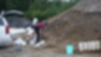 Sierra McRoberts fills sandbags at Dimond Park on Monday, Aug. 11, 2025, in preparation for an imminent glacial lake outburst flood. (Ellie Ruel / Juneau Independent)