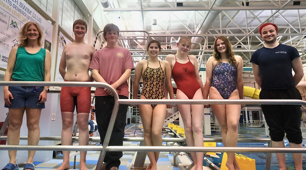 The Juneau-Douglas High School: Yadaa.at Kalé dive team poses for a photo Tuesday, Nov. 4, 2025, at Dimond Park Aquatic Center. From left are coach Savona Kiessling, Alexander Davis, Easton Berger, Taylor Mesdag, Moira Bahn, Adeline Williams and assistant coach Stig Cunningham. They will compete at the state championships Nov. 7-8 at Anchorage's Bartlett High School pool. (Klas Stolpe / Juneau Independent)