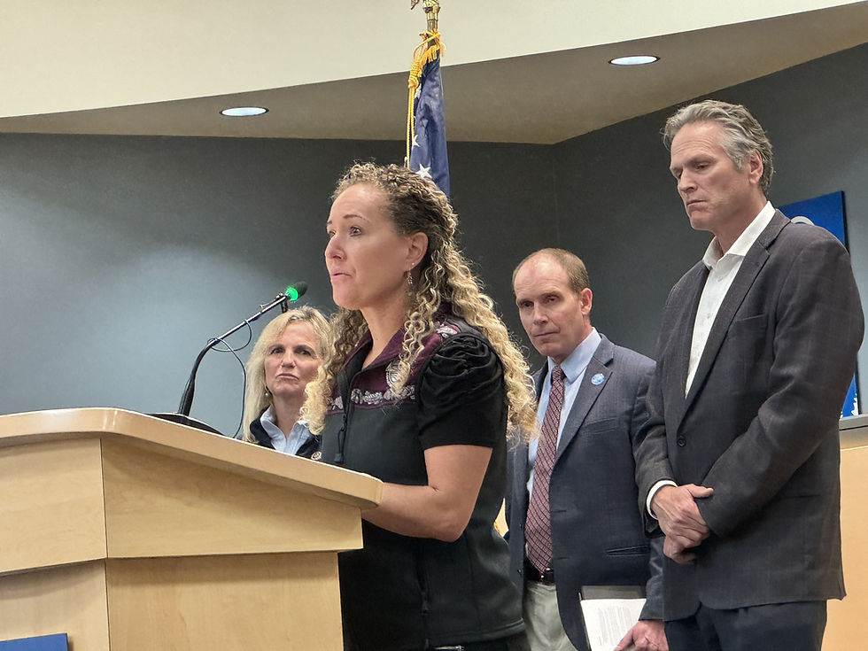Alaska Department of Health Commissioner Heidi Hedberg speaks during a bill signing by Gov. Mike Dunleavy, right, on Aug. 30, 2024. (Alaska Department of Health photo)