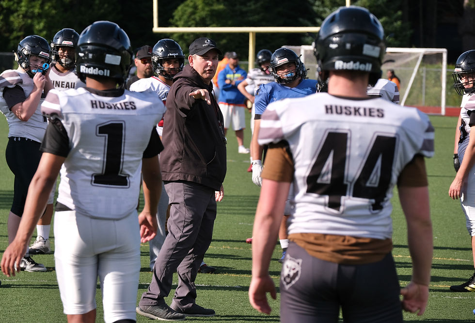 Juneau-Douglas High School: Yadaa.at Kalé head coach Rich Sjoroos talks to the Crimson Bears during practice Tuesday at the Thunder Mountain Middle School field. The Crimson Bears open their season Aug. 15 in Anchorage against the Service Cougars. (Klas Stolpe / Juneau Independent)